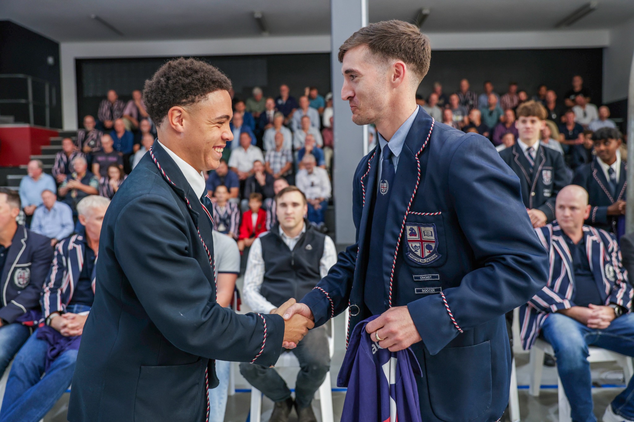 A WBHS pupil receiving recognition during a school assembly